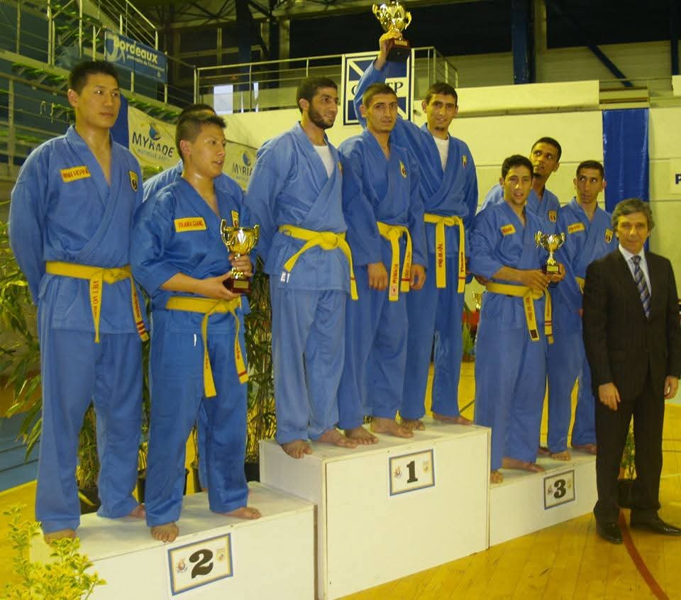 Team first-place podium with trophy at the Euro-African championship in Bordeaux
